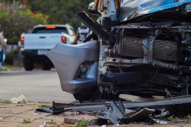 A pickup truck collided and lost control, colliding with a lamp post causing damage and injuries in this accident.